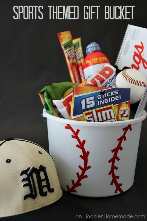 Personalize your gift giving with this Sports Themed Gift Bucket! Perfect for Father's Day, Birthdays, even a gift for the coach! Click on the photo to grab the instructions! Sports Easter Basket, Fathers Day Gift Basket, Homemade Gift Baskets, Christmas Gift Baskets Diy, Raffle Basket, Baskets For Men, Gift Baskets For Men, Raffle Baskets, Themed Gift Baskets