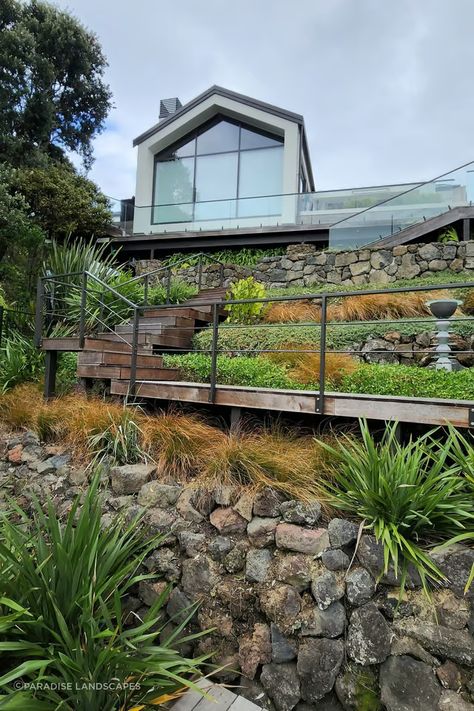 A paradise escape is as close as your own backyard | ArchiPro NZ Nz Native Plants, Paradise Landscape, Native Plant Landscape, Plants Landscape, Stone Garden Paths, Hardwood Stairs, Luxury Landscaping, Backyard Paradise, Sandy Soil