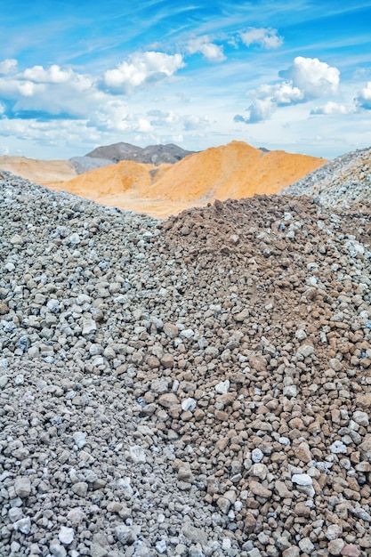 Piles of construction sand and gravel on... | Premium Photo #Freepik #photo #gravel #construction-materials #building-materials #pebbles Sand And Gravel, Material Textures, Construction Site, Construction Materials, Building Materials, Vector Photo, Premium Photo, The Sky, Stock Photos