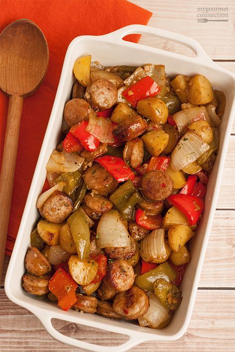 An easy dinner of Italian sausage, bell peppers and new potatoes, cut into bite-sized pieces and roasted with garlic, balsamic vinegar and olive oil. Peppers And Potatoes, Roasted Sausage, Garlic Balsamic, Sausage Peppers, Italian Sausage Recipes, Recipes Sausage, Sausage Dishes, New Potatoes, One Dish Dinners