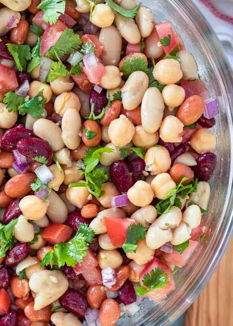 This 4 bean salad has tender red, pinto and cannellini beans, plus protein-rich chickpeas, and a spicy vinaigrette. The perfect cold salad for a summer bbq, or add meat to make it a main dish! Cold Bean Salad, Red Bean Salad, Recipes With Cool Whip, Salad Appetizer Cups, Layered Salad Recipes, Bean Salad Recipe, Noodle Salad Recipes, Ranch Pasta, Macaroni Salad Recipe