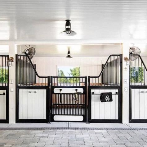 Stylish Equestrian™️ on Instagram: “Doors are opening & hearts are breathing. 🖤  Are you back at the barn yet?! If it’s this one (or any one really) we’re coming too.⠀⠀⠀⠀⠀⠀⠀⠀⠀…” White Stable Horse, Equestrian Stables Design, Horses Stables Ideas, Cute Horse Stables, Horse Stall Design, White Stables, Horse Stable Ideas, Stalls Ideas, Barns And Stables