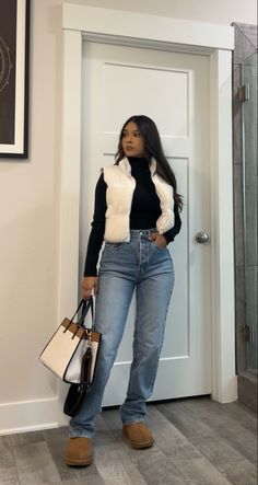 Wide leg jeans, black turtle neck lomg sleeve, sherpa puffer vest, coach color block tote bag #outfitideas #casualstyle #fallfashion #petitestyle Modest Fashion Winter Outfits, White Vest Outfits For Women Winter, Puffer Vest Skirt Outfit, Black Jean Fall Outfit, Winter Outfits With Wide Leg Jeans, Black Boots And Jeans Outfit, Winter Outfits Vest, Wide Leg Jeans With Boots, Trendy Mom Outfits Winter