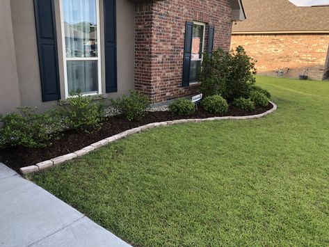 Dark brown mulch contrast well with light bricks and rocks Landscape Black Mulch Ideas, Front Yard Landscaping Mulch And Rock, Dark Mulch Landscaping Flower Beds, Landscape For Brick House, Front Yard Landscaping Porch, Mulch Beds In Front Of House, Front Yard Landscaping Brick House, Dark Brown Mulch Landscaping, Dark Mulch Landscaping