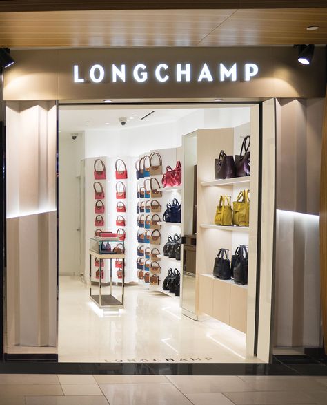 Longchamp opens with Lotte Duty Free in Guam - https://www.dutyfreeinformation.com/longchamp-opens-lotte-duty-free-guam/ Duty Free Shop, Travel Retail, Shop Sign Design, Shop Fronts, Interior Display, Travel Shopping, Kitchen Lighting Fixtures, Shop Front, Global Travel