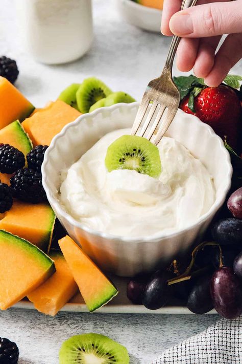 This 2-ingredient Fruit Dip is the perfect fluffy and creamy dessert dip! Tangy cream cheese is swirled with marshmallow creme to make a scoopable dip for fruit that's wonderful paired with your favorite berries and more. Yogurt Fruit Dip Recipe 3 Ingredients, Easy Fruit Dip 2 Ingredients, Recipe For Fruit Dip, Sugar Free Fruit Dip, Fruit Dip With Marshmallow Fluff, Marshmallow Dip For Fruit, Cream Cheese Fruit Dip Recipe, Dip For Fruit, Yogurt Fruit Dip