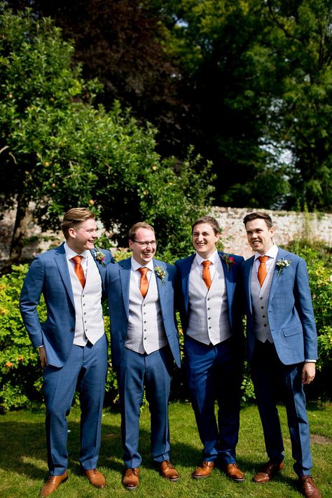 Navy And Orange Suit Wedding, Navy Blue Tuxedo Wedding Burnt Orange, Blue Suit Orange Tie Wedding, Navy Suit Orange Tie, Groomsmen Attire Orange, Orange And Blue Suit, Blue Suit Orange Tie, Disco Bridal Party, Dais Wedding