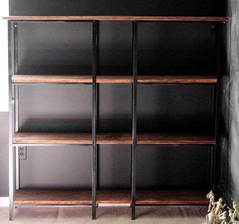 Bubby. Cheap metal shelves turned into high-end bookcase. Ikea Hack Bookcase, Bookshelf Ikea, Ikea Industrial, Ikea Kitchen Storage, Regal Industrial, Billy Ikea, Bookshelf Lighting, Industrial Bookcases, Metal Bookshelf