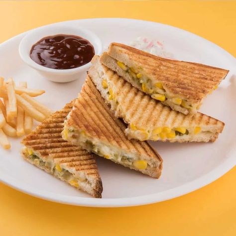 A wholesome and nutritious sandwich packed with flavourful mixed herbs, cheese and high protein rajma and corn. Grilled rajma masala sandwich is a fusion sandwich that is made for breakfast, lunch and dinner. It is wholesome and healthy all the way. This sandwich is filled with delicately herbed rajma and corn and tossed along with cheese to make it delicious. All you need is cooked rajma inhand in the kitchen and making this rajma corn sandwich will be breeze. Corn Sandwich Recipe, Masala Sandwich, Corn Grilled, Rajma Masala, Veg Momos, Food Stall Design, Corn Cheese, Stall Design, Friday Evening