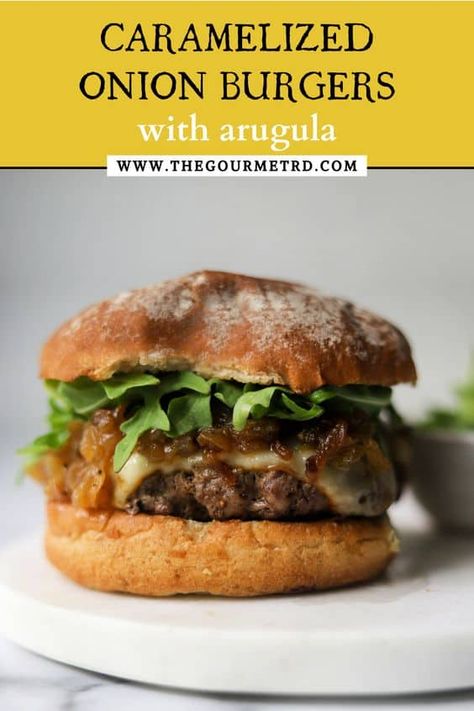 This perfectly grilled beef burger is juicy, flavorful and everything you’re looking for! It is topped with melty muenster cheese, heaps of caramelized onions and fresh, peppery arugula. Onion Burgers, Carrot Slaw, Muenster Cheese, Onion Burger, Grilled Beef, Beef Burger, Caramelized Onion, Beef Burgers, Good Burger