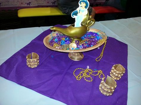 Alladin inspired centerpiece. Gold platter. Genie lamp. Gold cuffs. Jewels. Lamp Centerpiece, Shimmer And Shine Party, Princess Jasmine Party, Arabian Party, Arabian Theme, Jasmine Birthday Party, Aladdin Jr, Aladdin Birthday Party, Princess Jasmine Birthday Party