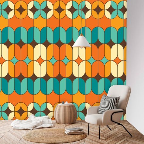 Imagine a wall mural that perfectly encapsulates the spirit of the 70s with a Mid-Century Modern twist. The wallpaper is designed with a vibrant color palette that primarily features shades of orange and teal blue. The pattern is geometric, with a mix of geometric and abstract shapes that interlock and overlap in a harmonious, yet dynamic arrangement. This design pays homage to the groovy aesthetics of the 70s, characterized by bold patterns and a sense of movement, while also embodying the slee 70s Wall Mural, Modern Peel And Stick Wallpaper, Mid Century Palm Springs, Mid Century Modern Christmas, Groovy 70s, 70s Decor, Vibrant Color Palette, Mid Century Modern Walls, Retro Valentines