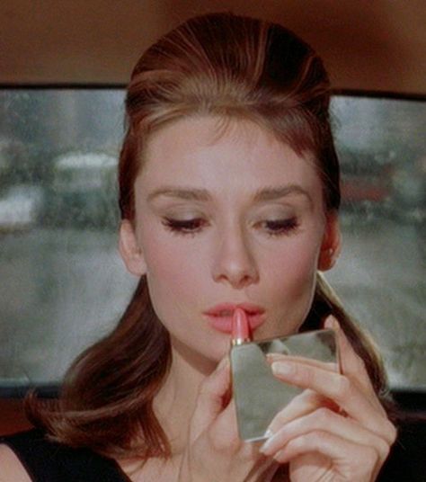 "Hand me my purse darling. A girl can't read that sort of thing without her lipstick." Breakfast At Tiffanys Aesthetic, Aubrey Hepburn, Pink Movies, Revlon Super Lustrous Lipstick, Lisa Eldridge, Holly Golightly, Parisian Lifestyle, Audrey Hepburn Style, Revlon Super Lustrous