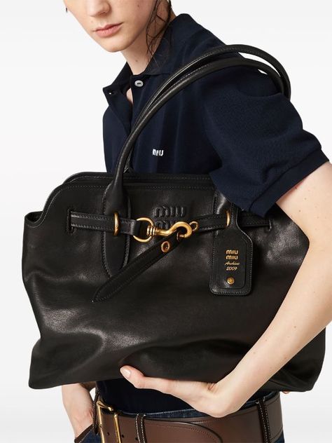 Miu Miu nappa-leather Tote Bag - Farfetch Miu Miu Bag, Peter Lindbergh, Black Leather Tote Bag, Leather Tag, Versace Outfit, Tote Bag Black, Iconic Bags, Work Bag, Summer Beach Wear