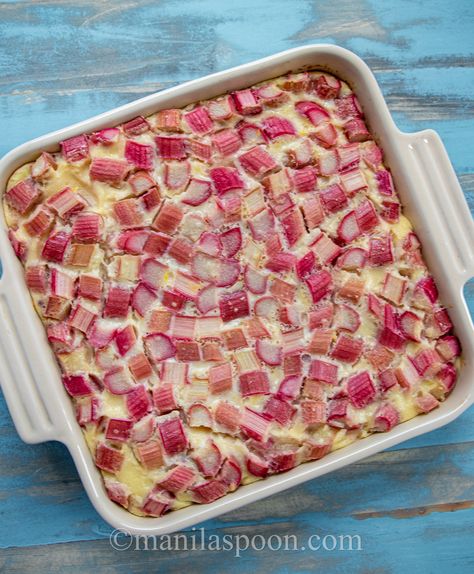 This rhubarb clafoutis is crazy easy to make. Simply dump the sliced rhubarb at the bottom of the pan and pour over the luscious custard-like batter on top then bake! The tart rhubarb adds a refreshing taste to this French classic dessert that makes it absolutely delicious! Whether enjoyed warm or at room temperature, a dusting of powdered sugar or some cream on top adds an elegant touch to this simple yet delectable dessert. Easy Rhubarb Custard Cake, Rhubarb Breakfast Recipes Healthy, Rhubarb Custard Dessert, Crustless Rhubarb Custard Pie, Rhubarb Custard Recipes, Rhubarb Desserts Easy, Rhubarb Recipes Easy, Rhubarb Clafoutis, Baked Rhubarb