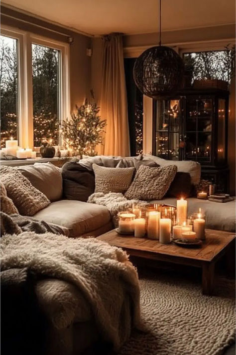 A cozy living room featuring a sectional sofa layered with plush throws and textured cushions, a wooden coffee table adorned with glowing candles, and soft ambient lighting from a mini tree and string lights, creating a warm and inviting atmosphere Living Room Chic Cozy, Comfy Den Ideas, 2nd Living Room Ideas Decor, Decorate Top Of Armoire For Christmas, Brown And Cream Living Room Ideas Cozy, Light Apartment Living Room, Nature Inspired Living Room Cozy, Living Room Evening Lighting, Light Living Room Designs