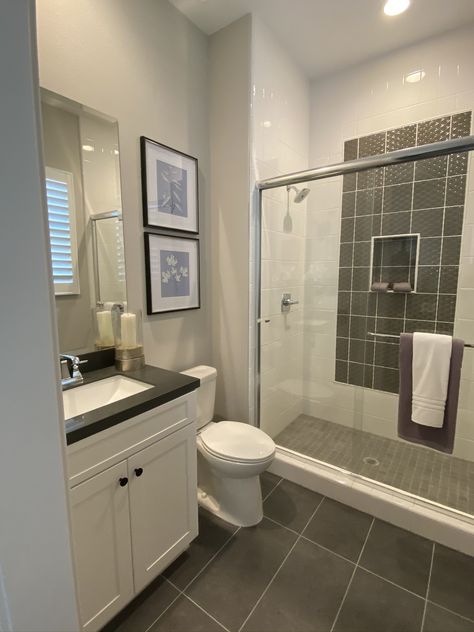 Dark Bathroom Floor Tile White Cabinets, Dark Tile Floors, Light Grey Bathrooms, Dark Counters, Grey Bathroom Tiles, White Molding, Full Bathroom Remodel, White Bathroom Cabinets, Dark Tile