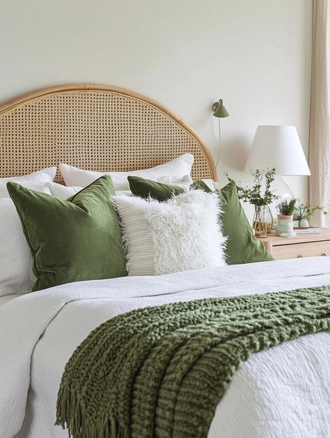 Transform your space with a home bedroom refresh! 🌟 This cozy setup features plush green cushions, a textured throw, and a rattan headboard. Perfect for creating an inviting and serene atmosphere. Try this look and enhance your comfort! #BedroomDecor #HomeRefresh 🌱 Sage And Rattan Bedroom, Rattan And Green Bedroom, Off White And Green Bedroom, White Tan And Green Bedroom, White Bed With Green Accents, White Gold And Green Bedroom, White Bedroom Green Accents, Sage Green Headboard, Tan And Green Bedroom