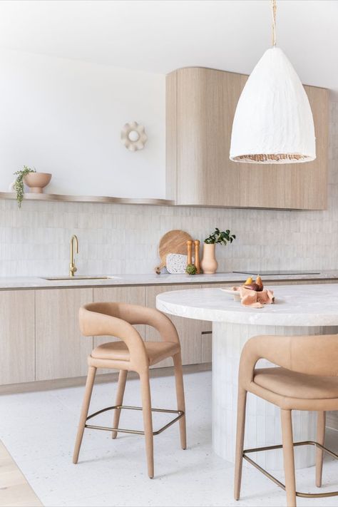 A bright white, open plan kitchen features curved details throughout with brushed brass accents. Curved Island Bench, Curved Island, Modern Family Kitchen, Curved Kitchen Island, Modern Kitchen Renovation, Curved Kitchen, Island Bench, Integrated Fridge, Family Kitchen