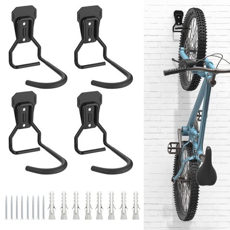 PRICES MAY VARY. 🛵 Heavy Duty Bike Rack: Made of strong iron material, provide a high load capacity, up to 77-99lbs/35-45kg. Strong enough to hold all kinds of bicycles, like mountain bike, road bike, cruiser bike, kids bike, etc. 🛵 Easy to Use: Hang and detach the bike in a second, easily store your bike inside your garage, carport, or apartment. 🛵 Horizontal Bike Storage: Foldable design that you can fold the bicycle holder upwards when not in use, save more space for storage. A must-have s Bicycle Hanger, Bike Hooks, Garage Hooks, Bike Hanger, Support Velo, Garage Bike, Bicycle Frames, Bicycle Storage, Bicycle Shop