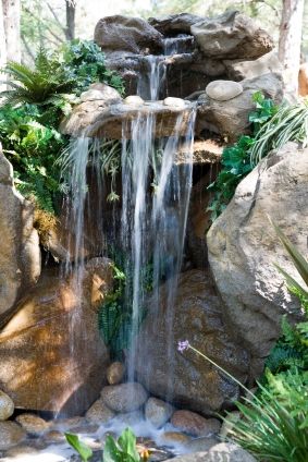 **How to Build a Backyard Pond Waterfall** Tip: Keep your pond filter pump separate from your waterfall pump to give yourself the option of turning off the waterfall at night or over winter. The difference in electricity usage will save you money. Garden Concept, Kolam Koi, Taman Air, Backyard Gardens, Living Garden, Outdoor Water Features, Gardens Ideas, Garden Waterfall, Gardening Design