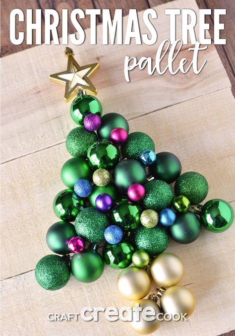 Christmas Ornament Tree On Wood, Christmas Tree Out Of Ornaments, Christmas Tree Made Out Of Ornaments, Christmas Tree Made Of Ornaments, Ornament Tree Diy How To Make, Ornament Christmas Tree Diy, Diy Ornament Tree, Christmas Pallets, Mini Christmas Tree Decorations