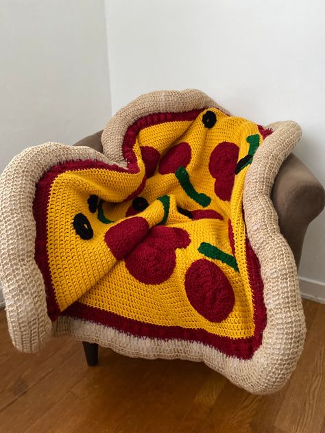 *Listing for premade, on hand pizza blankets only*   Included: 1 topping    Size: 43 inches Premade pizza blankets are an all time classic AND the most delectable gift for that pizza lover in your life! The Crochet Pizza Roadie is the ideal lap blanket for long car rides and serves as the perfect gift for ANY TIME of the year. Birthdays, housewarming, anniversary, holiday season, you name it, we have you covered... literally. Blankets take an average of 5-7 days to bake and deliver, so it's piping hot and ready to warm you up.  *This listing is for fresh and on hand pizza blankets only* Created with love from worsted weight yarn and recycled Poly-Fil. Averages 43" or greater due to the forgiving material.  *Made in a pet free, smoke free home.* Washing instructions:  1. Hand wash (preferre Unique Crochet Pillows, Crochet Apple Blanket, Crochet Blanket Tapestry, Fun Crochet Pillows, Crochet Pet Blanket, Crochet Quick Gifts, Crochet Gift For Dad, Crochet Housewarming Gift, Crochet Gifts For Boys