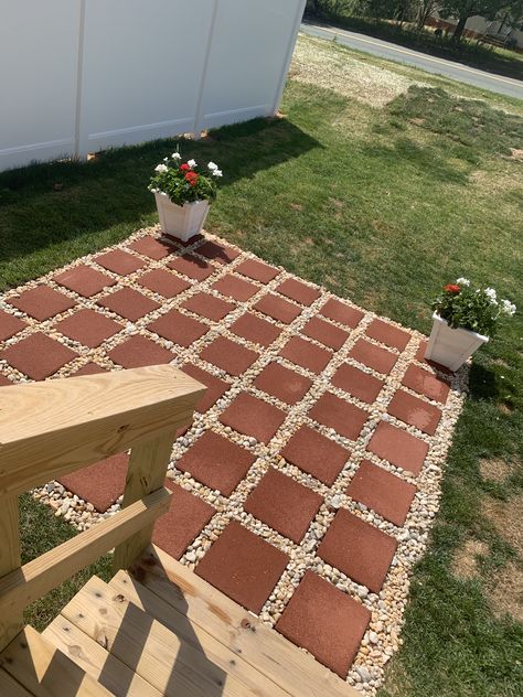 This easy DIY patio is perfect for your summer bbq. For a smaller space. 9x9 for less than $100 49 12x12 pavers 11 bags of yellow river rock  Shovel Rake Measuring flags  Measuring tape. That’s all you need to do this easy project. #diy #project  #patio Diy Simple Patio, Creating A Patio On A Budget, Diy Front Patio Ideas Budget, Cheap Diy Backyard Patio Ideas Simple, Diy Easy Patio Ideas, Easy Diy Backyard Patio, Patio Using 12x12 Pavers, Budget Patio Decor, Diy Cheap Patio Ideas