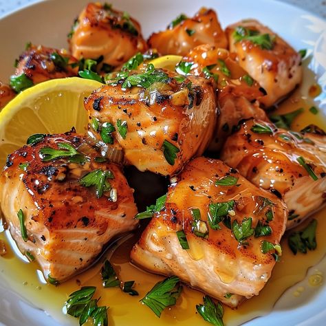 🐟✨ Luxurious Honey Butter Garlic Glazed Salmon Bites are a must-try for seafood lovers! 🐟 🐟 Honey Butter Garlic Glazed Salmon Bites 🛒 Ingredients: Salmon fillets: 1 lb, cubed Butter: 3 tbsp Garlic: 3 cloves, minced Honey: 3 tbsp Lemon juice: 2 tbsp Parsley: Chopped, for garnish 👩‍🍳 Instructions: Glaze: In a pan, melt butter with garlic, then add honey and lemon juice. Cook: Add salmon cubes, cook until glazed and cooked through. Serve: Garnish with parsley. 🌟 A delightful twist on salmon ... Glazed Salmon Bites, Dinner Recipes Date Night, Salmon Cubes, Twist Recipes, Food Salmon, Salmon Bites, Chicken Pot Pie Soup, Pot Pie Soup, Luxury Food