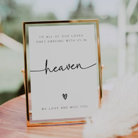 Remember your loved ones in a special way with our "Dancing With Us in Heaven" sign. This loving memory table sign is perfect for weddings, allowing you to honor those who are no longer with us but forever dancing in heaven. Our editable sign features a heartfelt message that will bring comfort and warmth to your celebration. Light a candle and let their presence be felt as you commemorate them with this beautiful in memory sign. Include this touching heaven wedding sign in your wedding signage To Our Loved Ones In Heaven, Memorial Display Wedding, Wish You Were Here Wedding, In Loving Memory Wedding Sign, Honoring Loved Ones At Wedding, Wedding Sign For Lost Loved Ones, I’m Loving Memory Wedding, People In Heaven Wedding Memory Table, Family In Heaven Wedding Sign