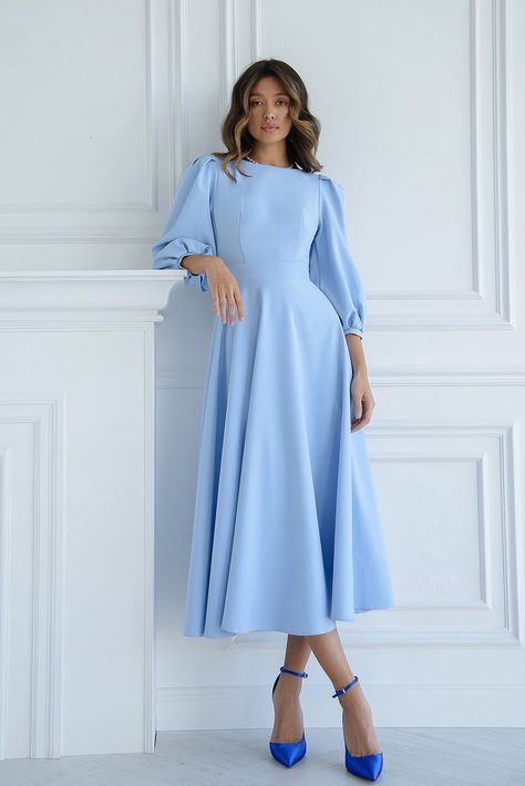 Enter the realm of elegance with ELAGIA's Sky-Blue Backless Puff Sleeve Midi Dress, a graceful ensemble blending chic style and sophistication. The delightful sky-blue hue, coupled with the allure of the backless design and charming puff sleeves, offers a stunning statement piece for any special occasion. #skyblue #backlessdress #puffsleeves #elegantstyle #sophisticatedfashion #womenswear Sky Blue Outfits For Women, Blue Winter Dress, Light Blue Long Sleeve Dress, Blue Winter Dresses, Sky Blue Outfit, Sky Blue Dress, Backless Midi Dress, Puff Sleeve Midi Dress, Blue Long Sleeve Dress