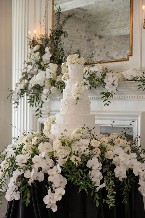 This Gorgeous cake display was at The Mason The stunning cake is designed by Dallas Affairs Bakery and of course the flowers are by us! Photo by V G Photography #wedding #weddingcake #weddingdesign #weddingdesign #weddingflowers #wildroseevents #weddingfireplace #weddingreception Wedding Cake Display Table Elegant, Cake Table Florals, Cake Table Wedding Decorations, Flower Cake Table, Sweet Heart Table Decor, Floral Cake Table, Vintage Cake Table, Cake Table Flowers, Wedding Cake Tables