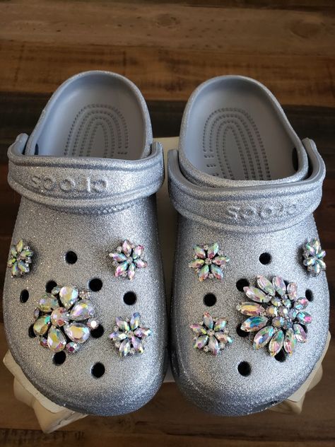 Handmade iridescent croc charms bling silver bedazzled. Silver Crocs Outfit, Bedazzled Crocs Shoes, Silver Crocs Shoes, Crocks Shoes Glitter, Gray Crocs With Jibbitz, Bedazzled Crocs White, Black Bedazzled Crocs, Glitter Crocs, Croc Decor