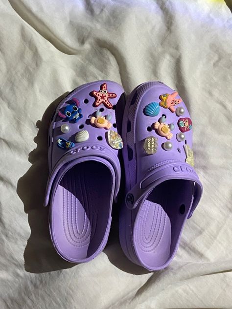 Dark Purple Crocs Outfit, Crocs Charm Ideas, Crocs Designer Jibbitz, Purple Crocs With Jibbitz, Crocks Shoes Purple, Jibbitz Crocs Charms, Croc Charms For Purple Crocs, Purple Custom Crocs, Light Purple Crocs With Charms