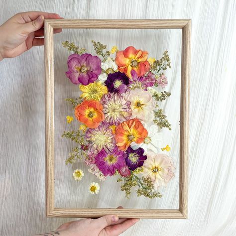 Preserve each delicate detail and blush of colour with our pressed flower frames. A modern take on a traditional art form, transforming your bouquet into a treasured piece for your walls. Frames are available in black, white or oak. Flowers are float mounted to give the frame a transparent background. If you prefer a solid background our Standard Mount is for you. Postage for frame sizes A2 and above will be quoted separately after checkout depending on what shipping method you choose. Pressed Flower Clear Frame, Pressed Wildflower Art, Pressed Flower Painting, Dried Flowers In Frame, Pressed Flowers In Frame, Pressed Flower Art Picture Frames, Pressed Flowers Framed, Pressed Flower Wall Art, Pressed Flowers Art