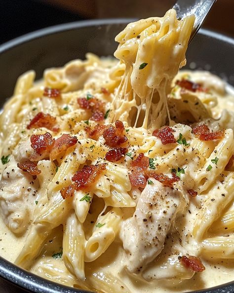 🍗 Creamy Chicken Bacon Ranch Pasta 🧀🥓 Ingredients: For the Pasta Dish: 12 oz pasta (penne or rotini) 2 tbsp olive oil 1 lb chicken breast, cubed 1 tsp garlic powder 1 tsp onion powder Salt and pepper to taste 6 strips bacon, cooked and crumbled 1 cup heavy cream 1 cup milk 1 package (1 oz) ranch seasoning mix 1 ½ cups shredded cheddar cheese ½ cup grated Parmesan cheese 2 tbsp fresh parsley, chopped (for garnish) Directions: Cook the Pasta: Boil the pasta according to package instructions... Alfredo Bacon Pasta, Creamy Chicken Bacon Ranch Pasta, Cheesey Pasta, Ranch Chicken Pasta, Bacon Ranch Pasta, Pasta Creamy, Chicken Bacon Ranch Pasta, Pasta Penne, Ranch Pasta