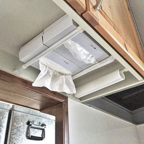 RV under cabinet storage tissues paper towels Rangement Caravaning, Rv Storage Organization, Rv Storage Ideas, Trailer Organization, Rv Travel Trailers, Camper Hacks, Camper Organization, Rv Organization, Camper Storage