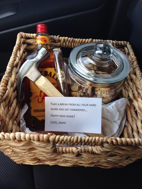 Housewarming gift for the boy; homemade macaroons in cookie jar, bottle of fireball, cigar and hammer with note in multi-purpose basket New House Gift Basket For Men, Men’s Housewarming Gifts, Housewarming Gift Ideas For Men Guys, House Warming Gift Ideas For A Man, Fireball Basket Gift Ideas, Housewarming Gift For Boyfriend, House Warming Gifts For Men Boyfriends, Housewarming Gift For Men, Fireball Gift Basket