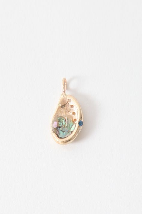 This charm is a one of a kind piece that mimics an abalone shell. Pieces of abalone are set into the charm alongside a 2mm sapphire colored cubic zirconia and a 1mm colorless cubic zirconia. Sapphire Color, Funky Jewelry, Enamel Charms, Abalone Shell, Gold Metal, Cubic Zirconia, Statement Necklace, Sapphire, Gold