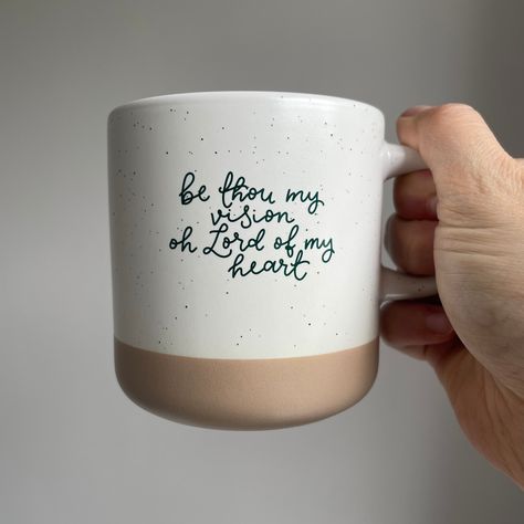 This Christian mug is the second in a growing collection of mugs that bring together faith and practicality. The 360ml capacity is brilliant for whatever beverage you crave - morning coffee, evening tea, or even a sneaky can of something fizzy. Enjoy not only a cup of your favorite drinks, but a reminder from one of the great hymns of the Christian faith. Be thou my vision oh Lord of my heart minimalist and aesthetic Christian mug This Christian mug is made to bring beauty and a moment to focus Mugs With Words, Pottery Painting Ideas Bible Verse, Glass Cups With Vinyl Christian, Cups Writing, Christian Mugs, Christian Mug Designs, Christian Coffee Mug, Bible Verse Cups Coffee Mugs, Be Thou My Vision