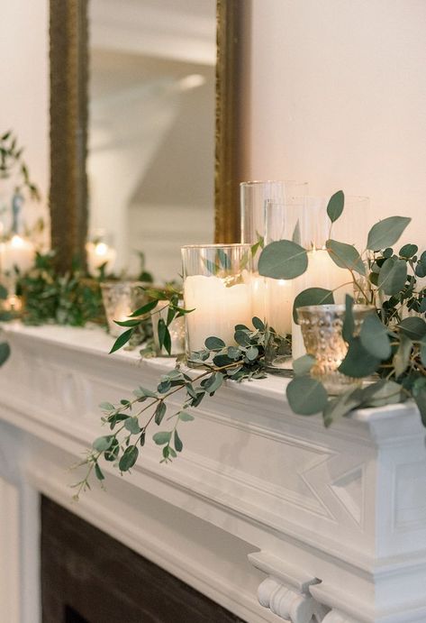 Fireplace Mantle With Garland, Lanterns With Candles And Greenery, Eucalyptus On Mantle, Candle Mantle Decor Wedding, Wedding Fireplace Candles, Flower Mantle Decor, Candles On A Mantle, Mantle Decorating Ideas Wedding, Eucalyptus Fireplace Mantle