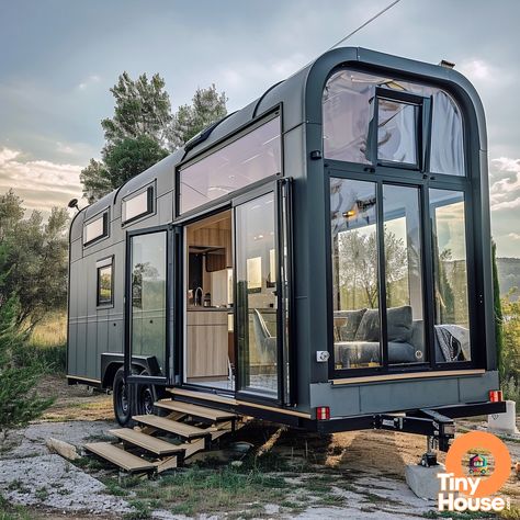 "Check out this stunning tiny house on wheels!  With its Mediterranean design style and beautiful Charcoal Gray and White color palette, this home is a true gem. What's your favorite design element? Would you incorporate any into your own home? #TinyHouse #MediterraneanDesign #TinyLiving" Tiny Glass House, Tiny Homes On Wheels, Homes On Wheels, Tiny Mobile House, Glass House Design, Mobile House, Tiny Home On Wheels, Tiny House Inspiration, Home On Wheels