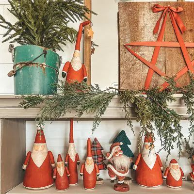 A VINTAGE FARMHOUSE CHRISTMAS | Shop Sales Events Antique Farmhouse Vintage Farmhouse Christmas, Santa Statues, Pennant Garland, Strong Hand, Santa Figurines, Christmas Shop, Painted Canvas, Table Display, Antique Farmhouse