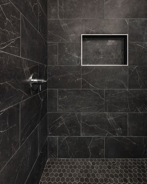 Bold, beautiful, and timeless: these black-tiled showers truly make a statement! Whether you choose a glossy or matte finish, black tiles create a stunning backdrop that complements any design.  Builder: @restorebuildanddesign  Design: @hawkinsandgraydesign  Photos: @lyndseymariephotography Best Shower Tile Ideas, Black Showers Bathroom, Dark Bathroom Accent Wall, Matte Black Shower Tile, Black Tile Shower Wall, Black Shower Ideas, Dark Grey Shower Tile, Shower Tile Ideas Walk In, Black Accent Wall Bathroom