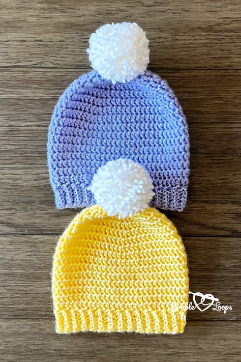 Bundle up the little ones with Lovable Loops' childrens crochet hat pattern. This beginner crochet pattern creates a cozy hat with a ribbed brim and a fun Pom Pom topping. Whether for playdates or chilly days, this free and easy design is a must-have for young fashion. Ready to stitch some joy? Visit our website to grab the full free pattern and let the crafting begin! #CrochetPattern #FreeCrochetPattern #LovableLoops Crochet Hat 12 Months, Crochet Children Hats Free Patterns, 12 Month Crochet Hat, Half Double Crochet Beanie Pattern Free, Crochet Top Down Hat, Crochet Childrens Hats Free Patterns Beanie, Crochet Childs Hat, Crochet Hat Free Pattern Kids, Easy Crochet Kids Hats