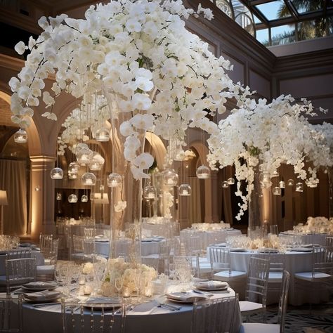 The interior design showcases a modern aesthetic. Wedding Centerpieces Luxury, White Wedding Esthetic, All White Wedding Venue Decor, White Luxury Wedding Decor, White And Crystal Wedding Decor, All White Floral Installation, Vizcaya Wedding, White Wedding Centerpieces, Wedding Ambiance