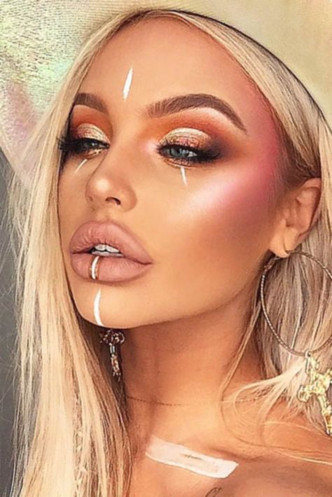 30 Coachella Makeup Inspired Looks To Be The Real Hit | Page 3 of 6 Boho Face Paint, Rave Face Paint, Boho Festival Makeup, Coachella Make-up, Coloured Braids, Tribe Makeup, Gold Face Paint, Festival Makeup Rhinestones, Festival Eye Makeup