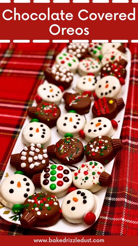 Overhead image of festive chocolate covered oreos in the design of snowmen with mini carrot noses and M&M ear muffs and white and milk chocolate ornaments on white plate on a red plaid tablecloth. Christmas Ornament Treats, White Chocolate Holiday Treats, Oreo Cookies Dipped In White Chocolate, Oreo Cookie Christmas Ornament, White Chocolate Covered Oreos Christmas, Oreo Christmas Ornament Cookies, Christmas Snacks No Bake, Chocolate Covered Oreo Ornaments, Oreo Cookie Christmas Treats