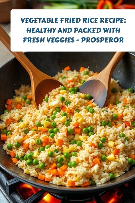 Vegetable fried rice in a wok with peas, corn, and carrots, accompanied by wooden spoons. Stir Fry Rice Recipe, Rice And Vegetable Recipes, Vegetable Fried Rice Recipe, Fried Rice Recipes, Vegetable Fried Rice, Vegetable Rice, Fried Vegetables, Fried Rice Recipe, Quick Weeknight Meals