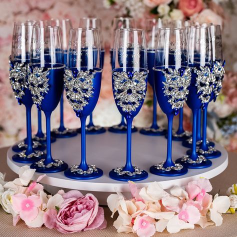 Make Your Quinceañera Celebration unique with Royal Blue Champagne Bottle and 4 Glasses Set - Ready to Be Filled with Joy, Best Quince Memories, and New Beginnings! Raise a toast to your journey to adulthood with a beautifully personalized Champagne Bottle and 4 Glasses, customized just for You. Set includes:~ bottle (empty) ~ 4 glasses.All the items are hand-made.Can be personalized with name and date of your celebration.We can decorate this set with any color or text you want. Royal Blue Champagne Glasses, Royal Quinceanera Theme, Midnight Blue Quinceanera Theme, Blue Silver Quinceanera, Royal Blue Quinceanera Ideas, Royal Blue Quinceanera Decorations, Royal Blue Quince Theme, Butterfly Quince Theme, Royal Blue Quinceanera Theme